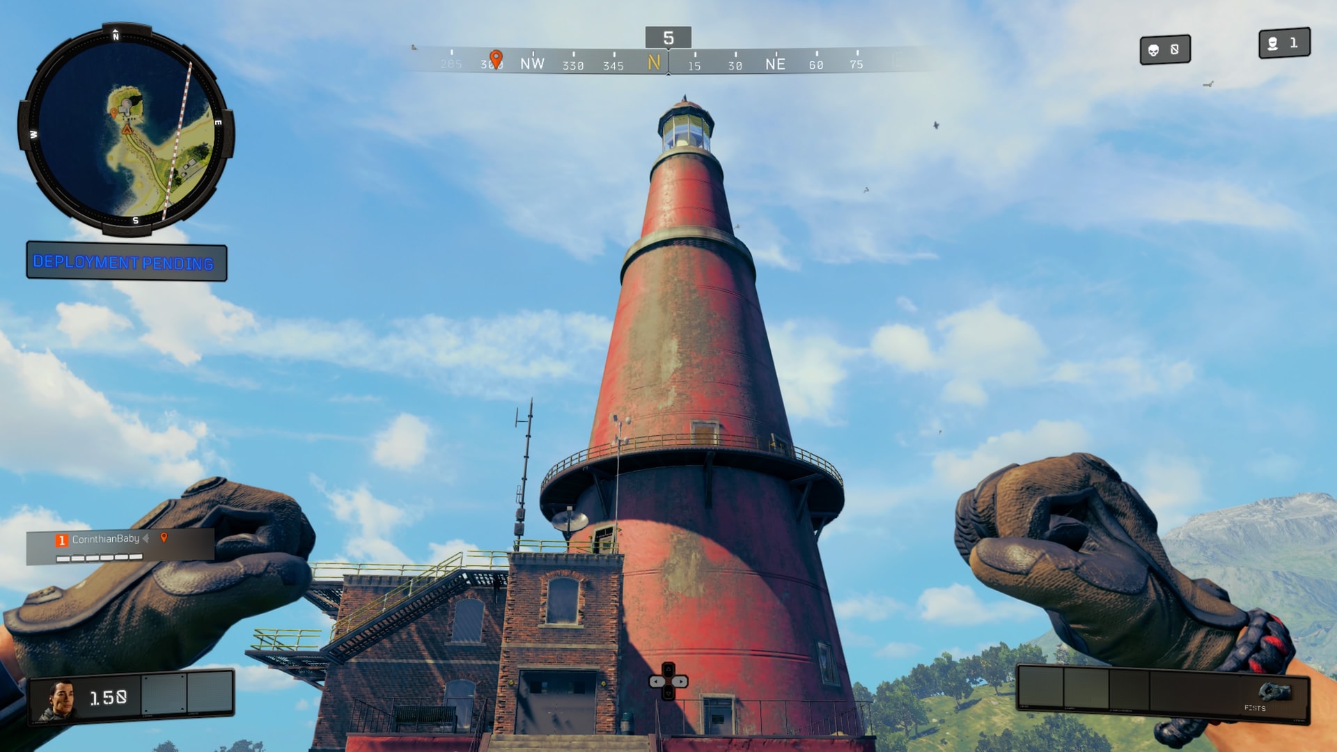 The red lighthouse against a blue sky, seen from its base