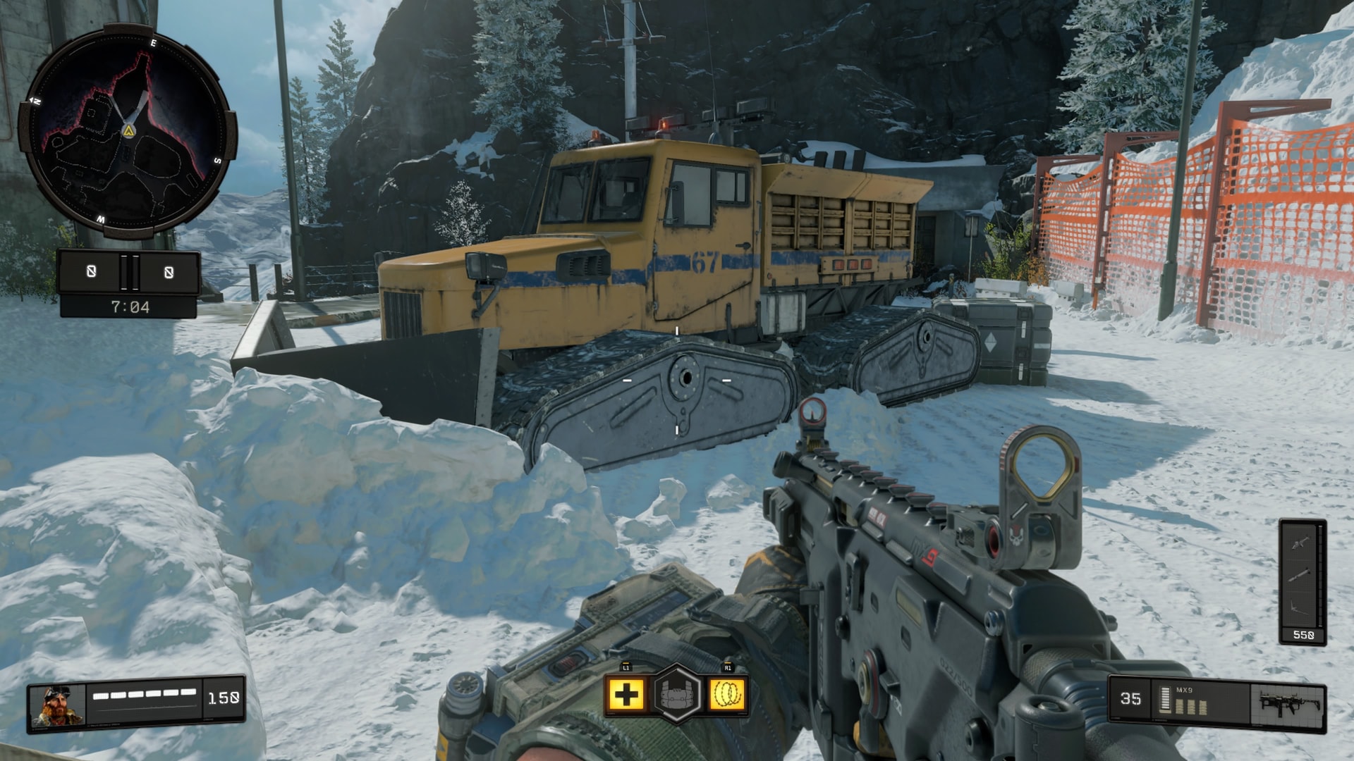 A yellow snowplow beside a snowbound road on Payload