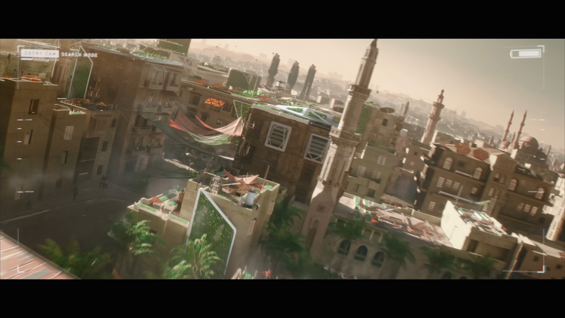 A drone’s view over the market’s rooftops: minarets, planted terraces, solar panels, and awnings strung between the buildings