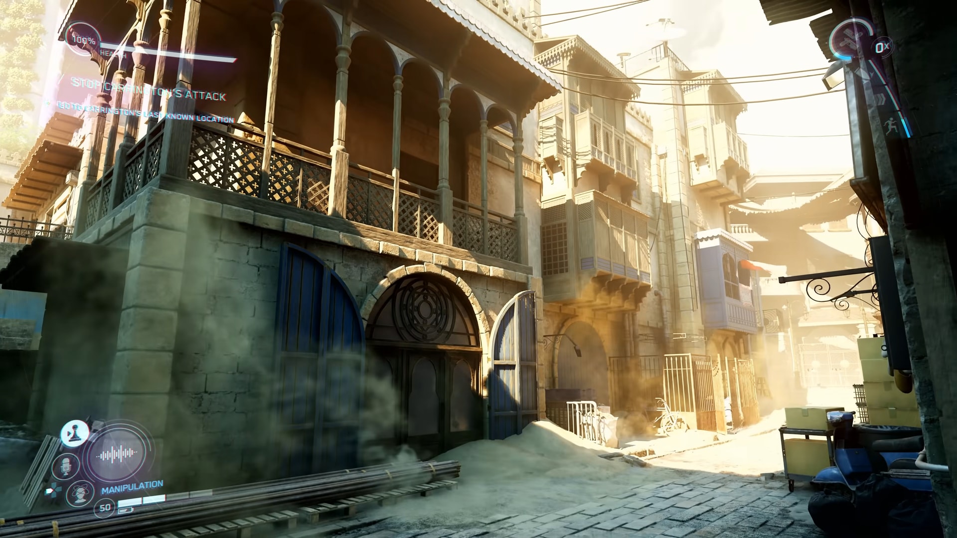 A sunlit alleyway of balconies, latticed screens and scaffolding, dust hanging in the air